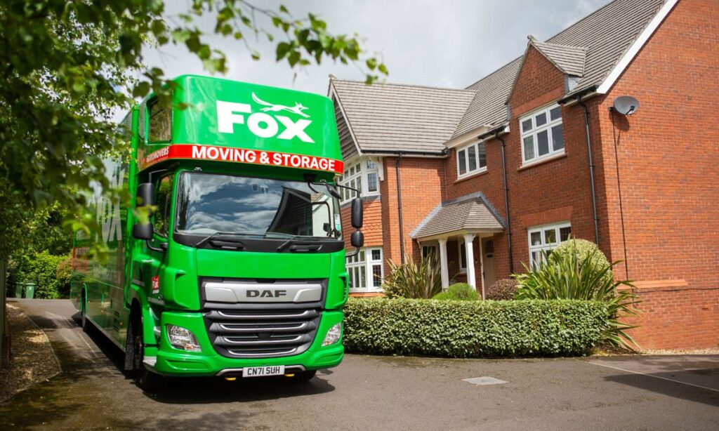 fox moving and storage van outside a home