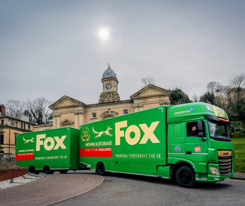 fox moving and storage vans outside of custom house building in penarth