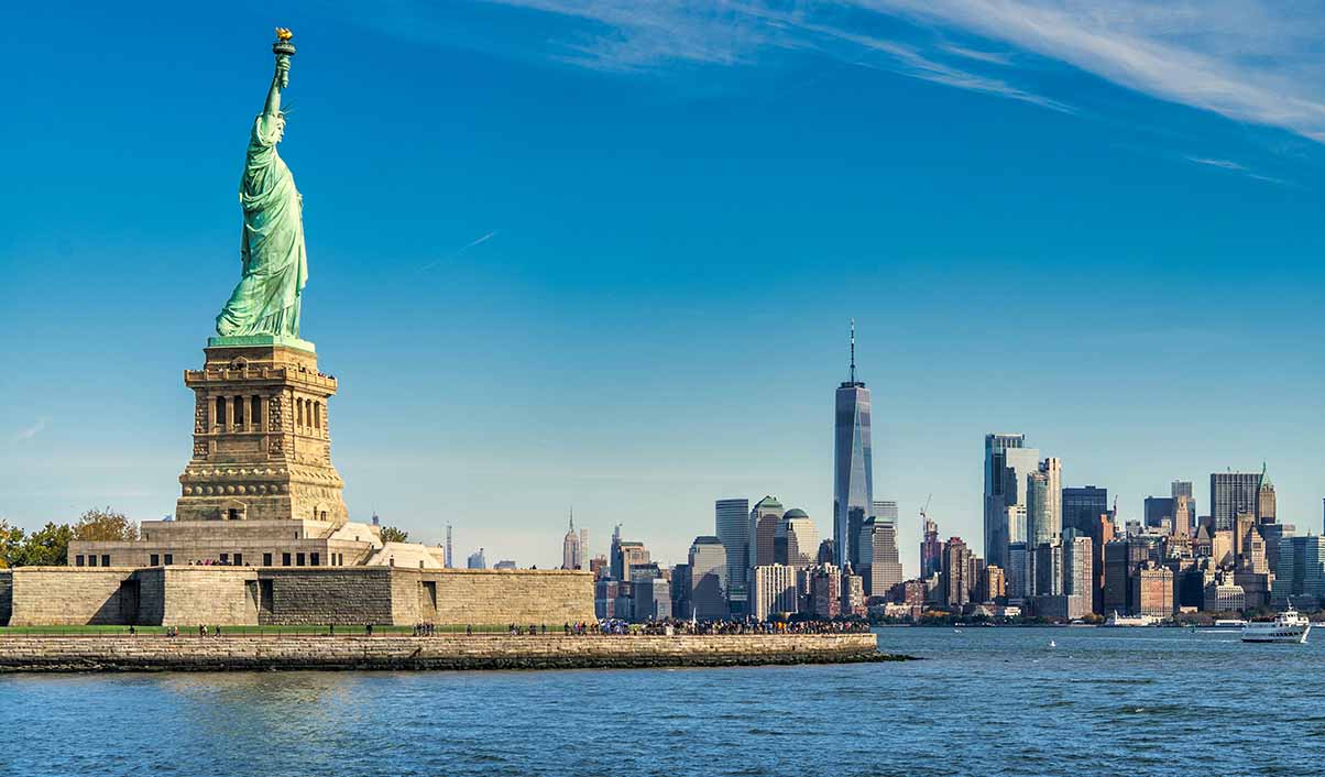 statue of liberty and new york skyline
